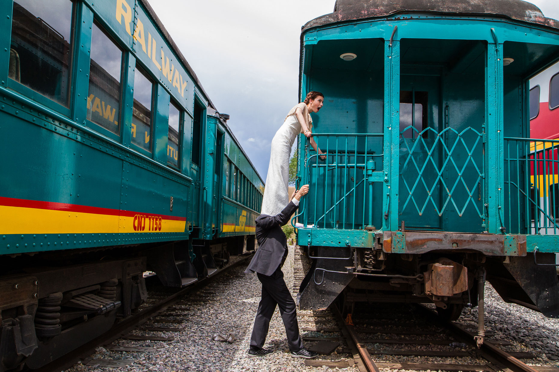 Santa Fe Railyard funny couple on train, Elopement photography
