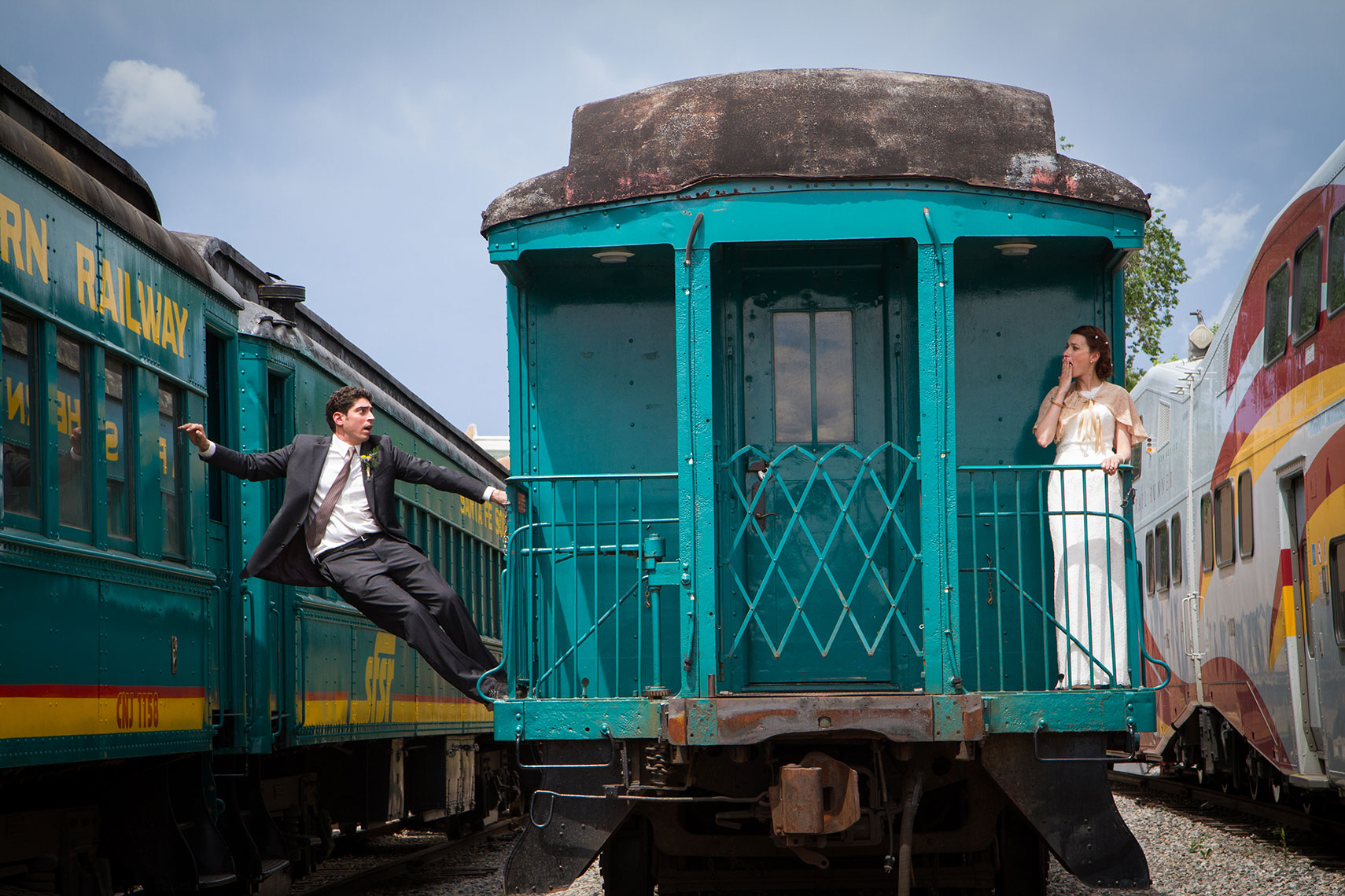 Funny Bride and Groom on train in the Santa Fe Railyard after their Courthouse Elopement