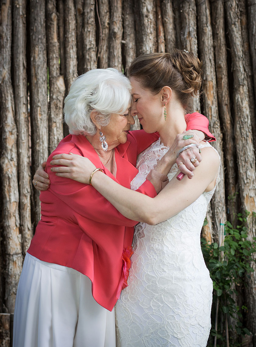Bride hugging mother at a Santa Fe Canyon Road Wedding