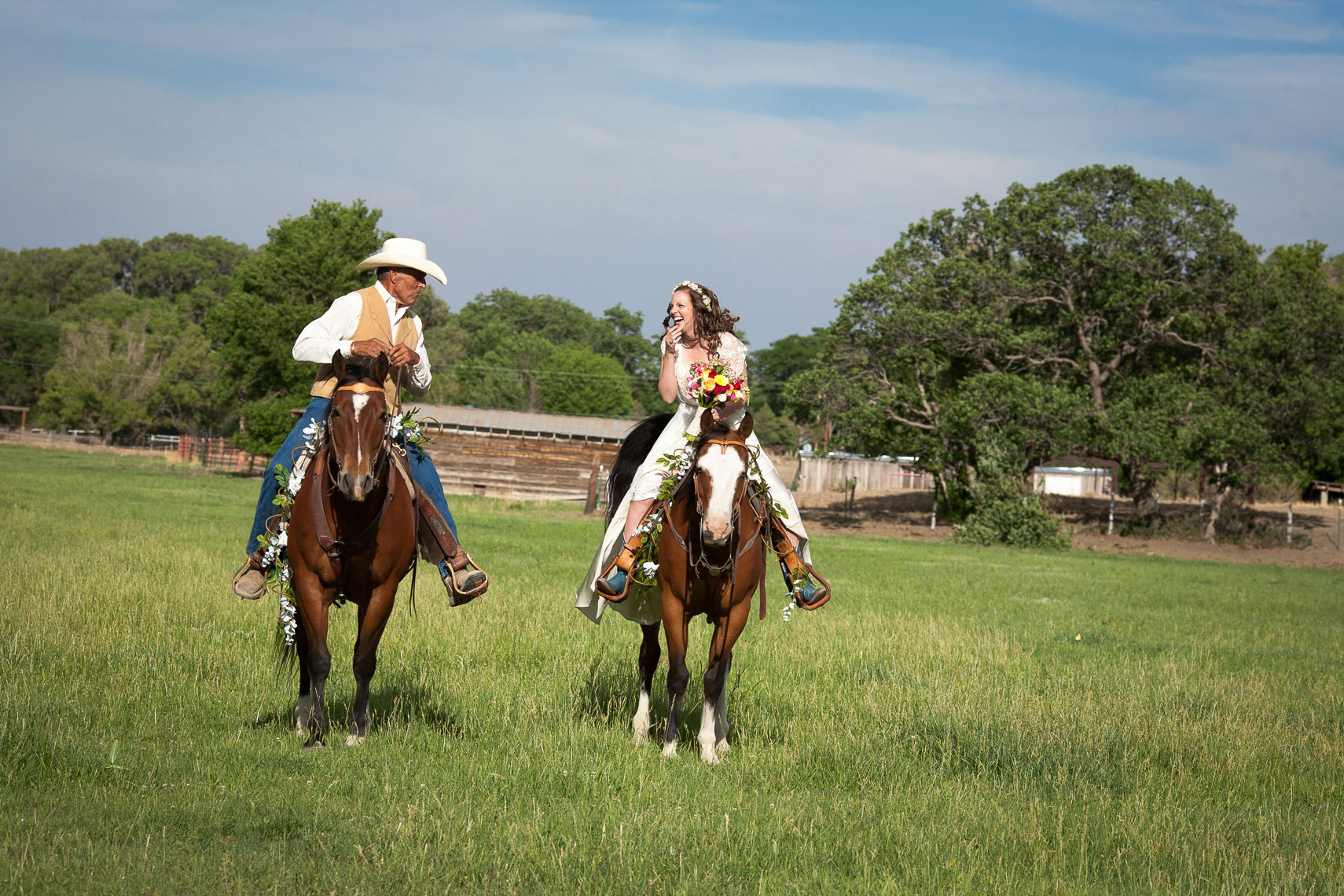 Bride comes down aisle on horse at her parents ranch in Cimarron, NM